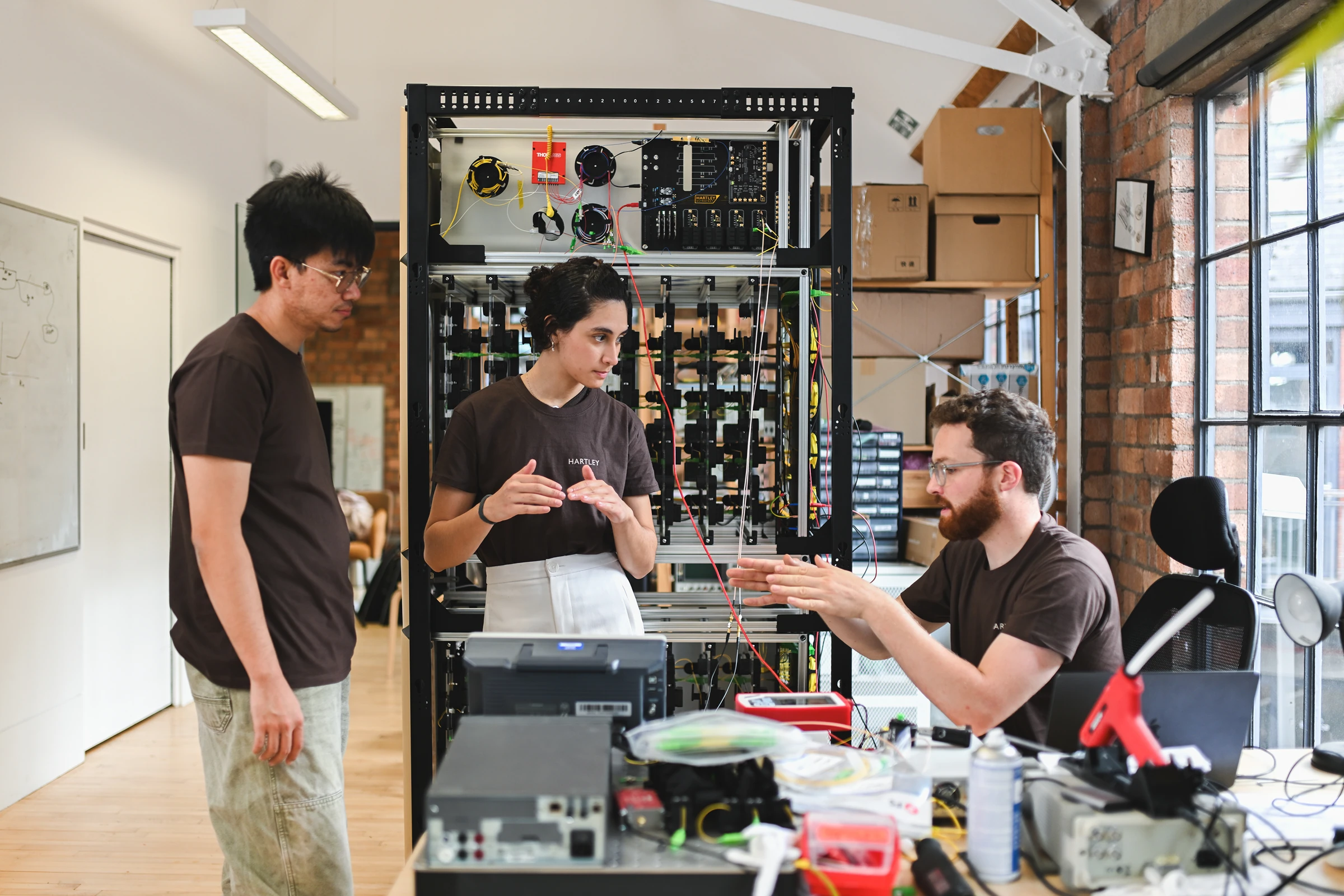 Three people discussing in an office