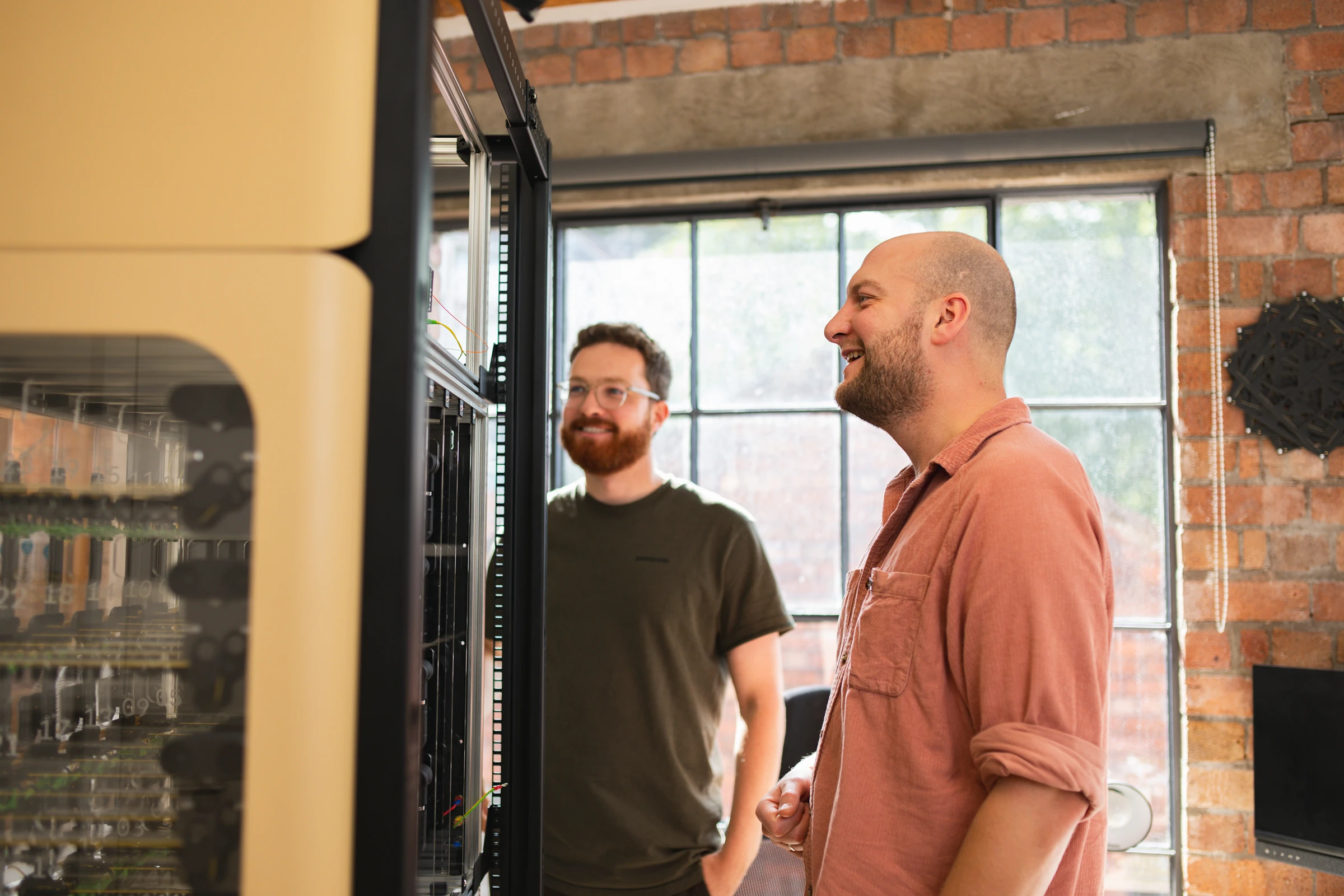 Two men looking at a machine